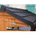 Close up image of black plastic roof verge covers by lightweight tiles