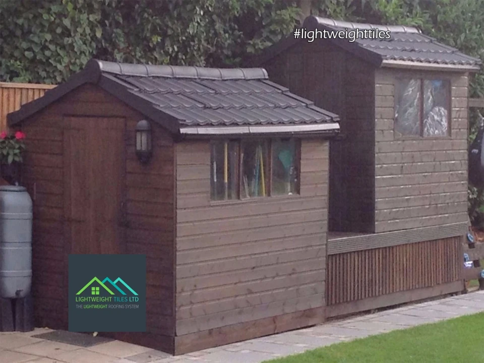 Image of two garden shed roof replacement with black Lightweight Tiles