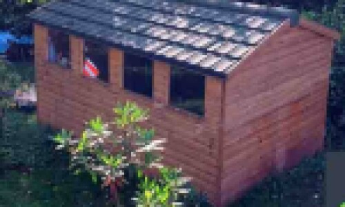 Large garden shed roof replacement with Green Granulated recycled tiles