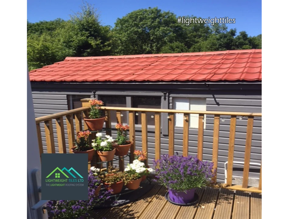 Image of two garden shed roof replacement with black Lightweight Tiles