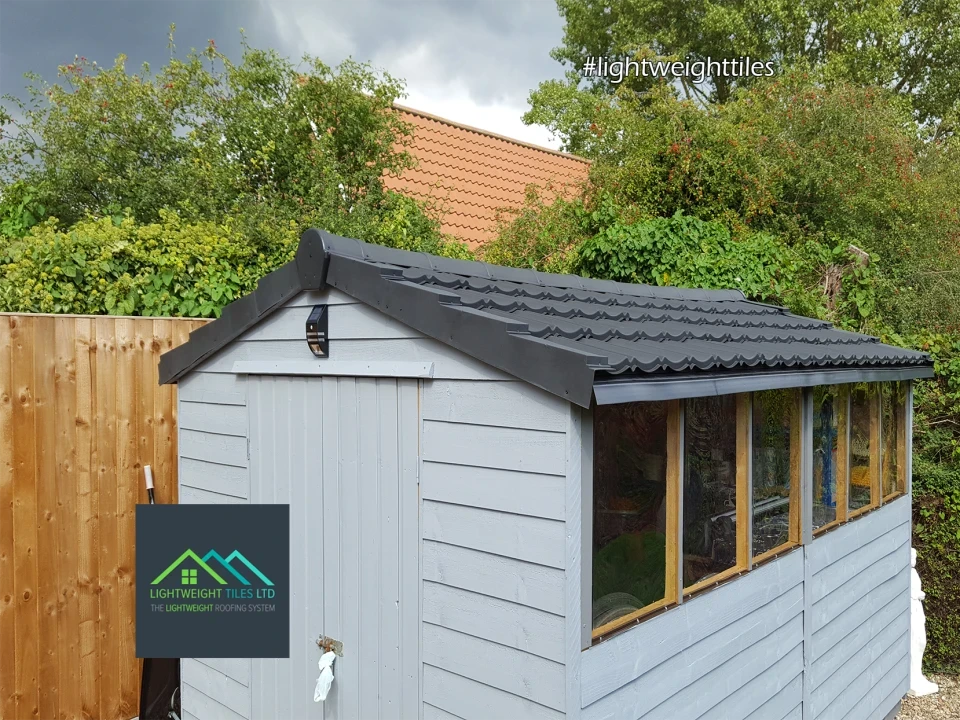 renovated shed with black recycled shed roof replacement tiles | Lightweight tiles